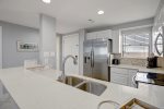 Updated galley kitchen with Corian counters
